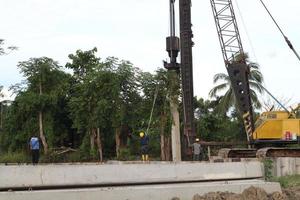 Gorontalo, Indonesia - January 2023 - Projects of river widening and the construction of dykes around the Limboto lake area photo