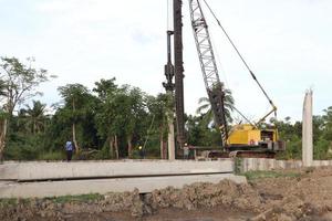 Gorontalo, Indonesia - January 2023 - Projects of river widening and the construction of dykes around the Limboto lake area photo