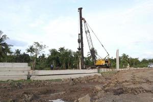 Gorontalo, Indonesia - January 2023 - Projects of river widening and the construction of dykes around the Limboto lake area photo