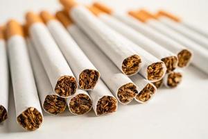 Cigarette, tobacco in roll paper with filter tube isolated on white background, No smoking concept. photo