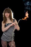 Pretty young woman with a gas torch photo