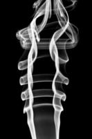 Abstract white smoke. Isolated on black background photo