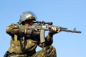 Army soldier with machine gun photo