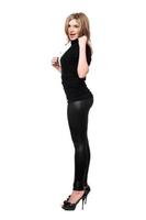 Sexy young woman in leggings. Isolated photo