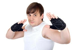 Portrait of the young fighter. Isolated on white background photo