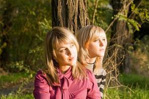 Two beauty young blondes in the light of the sunset photo