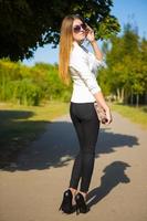 Girl in the park with a handbag photo