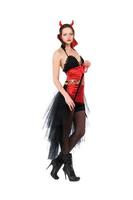 Young woman in devil costume for halloween photo