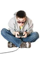 Young man in sunglasses with a joystick photo