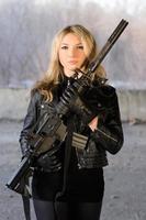 Armed beautiful young woman photo