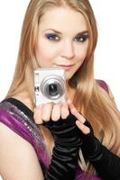 Young beautiful blonde holding a photo camera