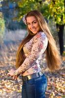 smiling young woman outdoors photo