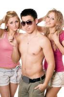 Portrait of a two beautiful blonde women with young man photo