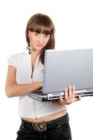 Young businesswoman with laptop over white photo