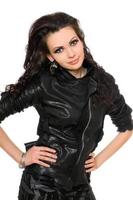 Portrait of beautiful young brunette in black clothes photo