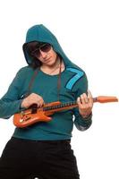 Young man in sunglasses with a little guitar photo