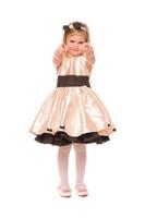 Charming little lady in a dress. Isolated photo