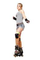 Attractive young blonde on roller skates photo