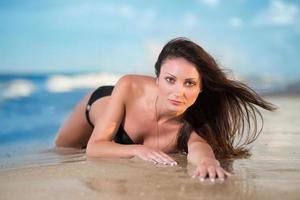 Pretty woman in black swimsuit photo