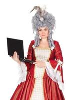Woman in queen dress with laptop photo