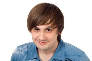 Portrait of  the smiling young man. Isolated. photo