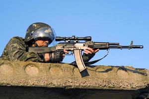 Army soldier with machine gun photo