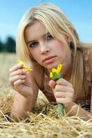 Young bond woman with flower photo