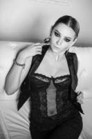 Thoughtful woman in black lingerie photo