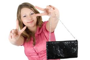 Beautiful playful young woman with a handbag. Isolated photo