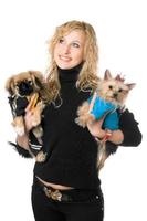 Portrait of happy young blonde with two dogs photo