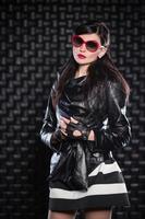 Beautiful woman wearing black leather jacket photo