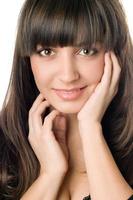 young woman with dark hair and brown eyes photo