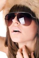 sexy woman wearing sunglasses with sugar lips photo