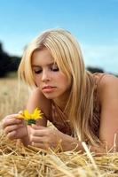 Young bond woman with flower photo