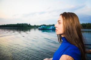 Portrait of beautiful pensive young brunette photo