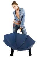 Young woman in a blue denim suit photo