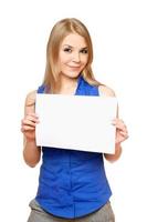 Beautiful young woman holding empty white board photo