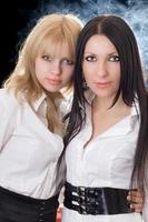 Portrait of the young brunette and blonde photo