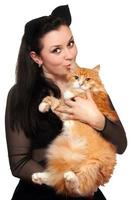 Portrait of young woman with a red cat photo