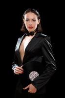 Gorgeous brunette wearing a black suit photo