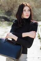 Brunette with bag photo