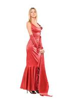 Elegant young blonde in red dress. Isolated photo