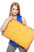 Young woman posing with yellow vintage board photo