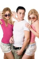 two happy blonde women with handsome young man photo