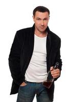 Man with a bottle of scotch. Isolated photo