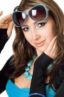 Closeup portrait of attractive young woman in sunglasses photo