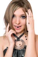 Portrait of smiling pretty girl with a bead photo