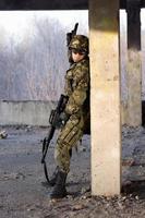 Adult man with rifle and gun photo