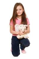 Pretty little girl with a teddy elephant photo