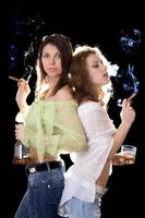 Portrait of the two girlfriends with a cigars photo